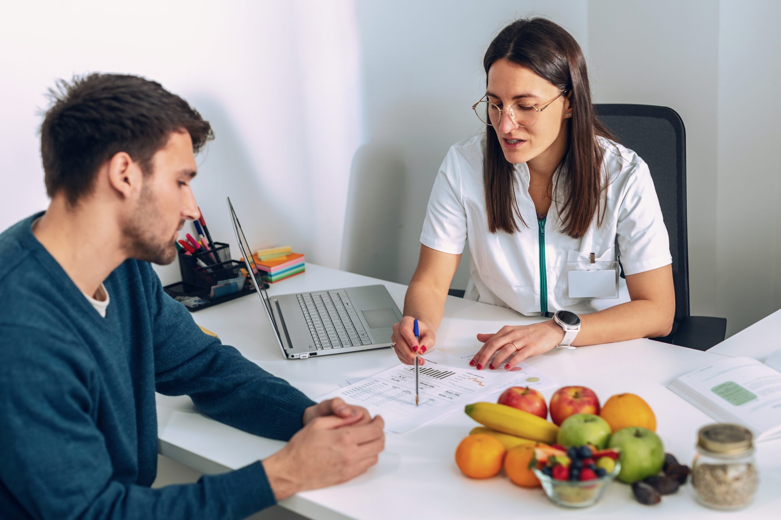 Weight loss doctor and a man consultation scaled
